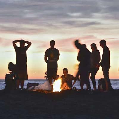 Students at a nighttime bonfire